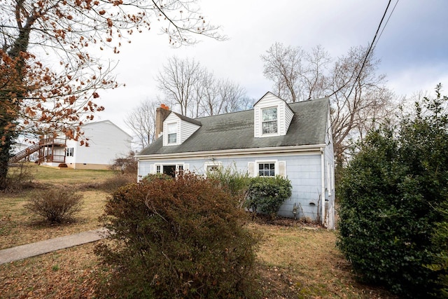 view of side of home with a chimney