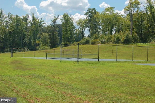 surrounding community with a yard and a rural view