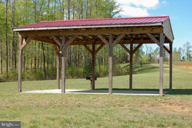 view of property's community with a lawn