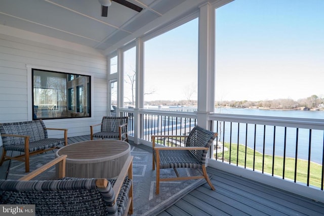 sunroom with a water view and plenty of natural light