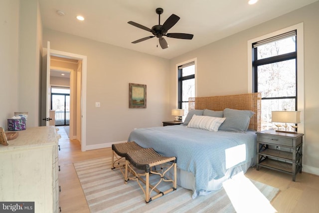 bedroom featuring ceiling fan and light hardwood / wood-style floors