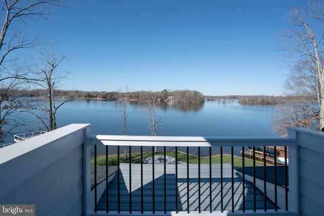 property view of water featuring a balcony