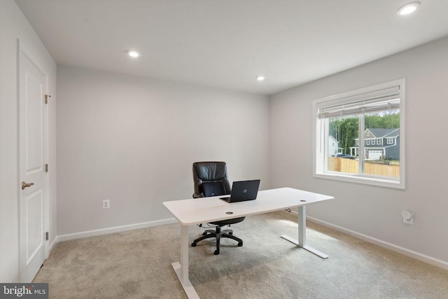 office area with light colored carpet