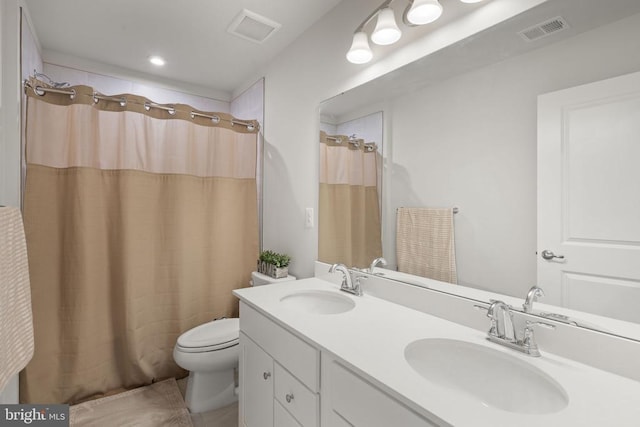 bathroom with vanity, toilet, and a shower with shower curtain