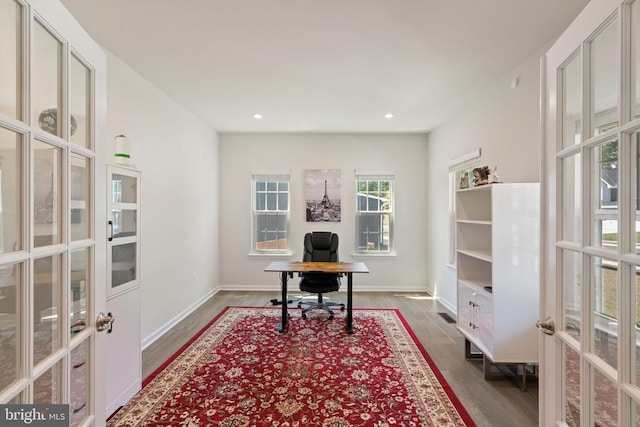 home office featuring hardwood / wood-style flooring and french doors