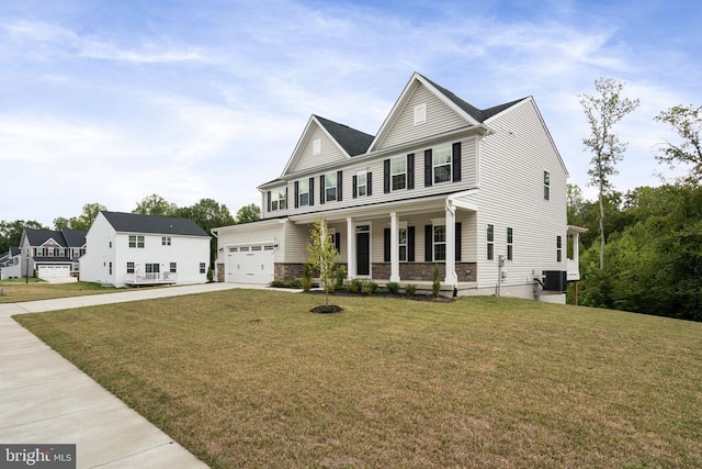 view of front of house featuring central AC unit, a garage, a front yard, and covered porch