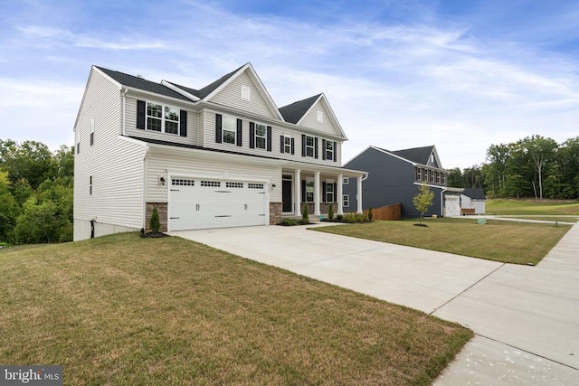 view of front of house featuring a garage, covered porch, and a front lawn