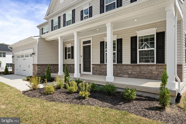 view of front of property with a garage and covered porch