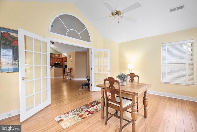 dining space featuring visible vents, baseboards, light wood-style flooring, and a ceiling fan