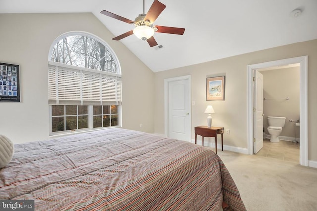 bedroom featuring visible vents, light carpet, high vaulted ceiling, ensuite bathroom, and baseboards