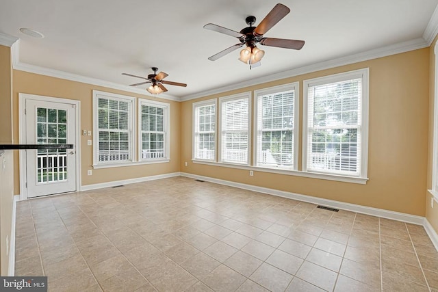 interior space featuring visible vents, baseboards, a ceiling fan, and crown molding