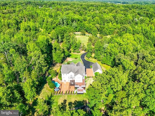 bird's eye view featuring a forest view