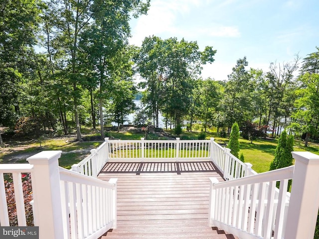 deck featuring a lawn