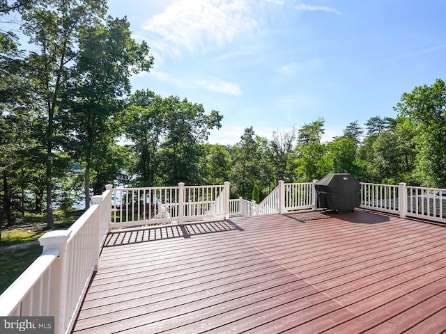 wooden terrace featuring grilling area