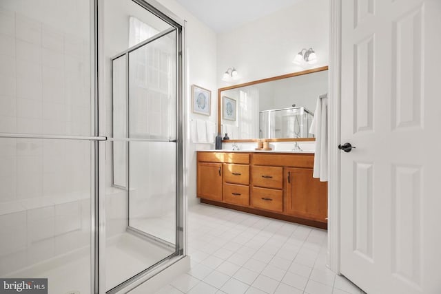 bathroom with vanity, tile patterned flooring, and walk in shower