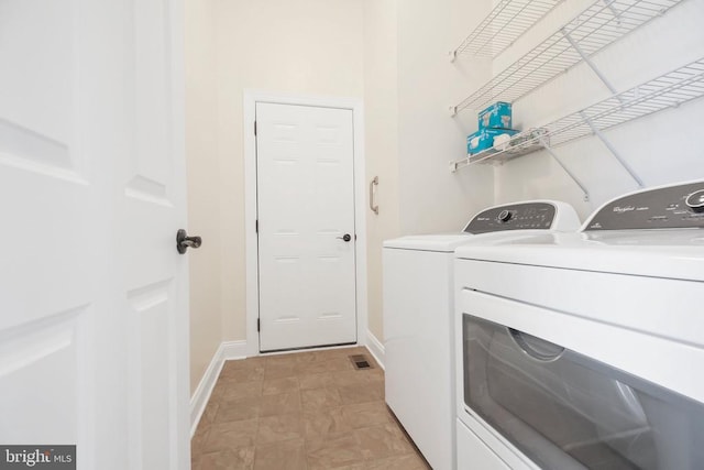 laundry area with washer and clothes dryer