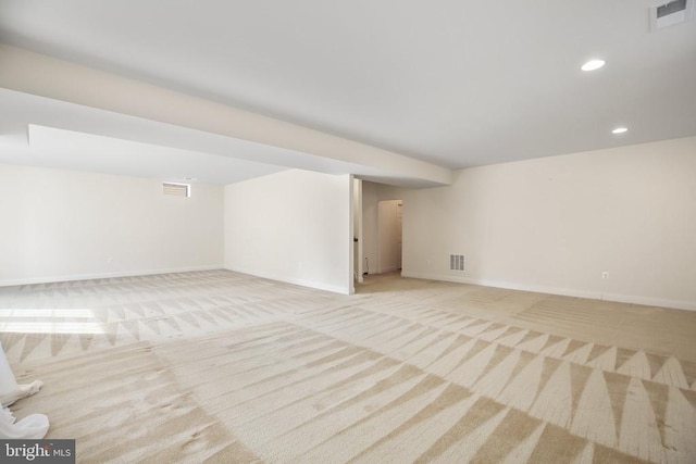 basement featuring light carpet