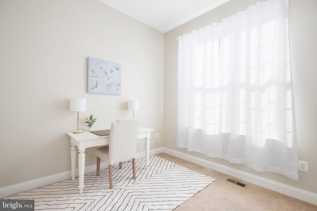 home office with light carpet