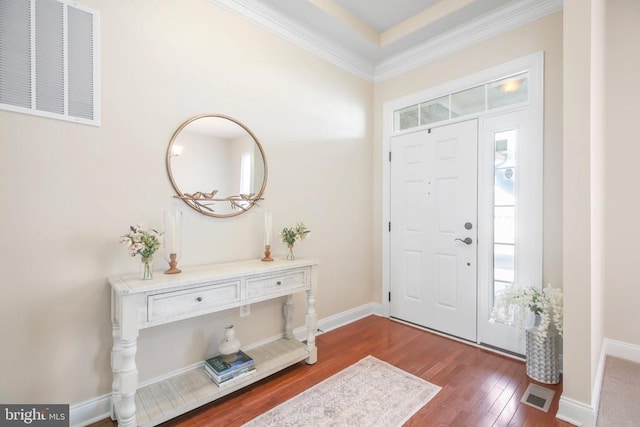 entryway with crown molding and dark hardwood / wood-style flooring