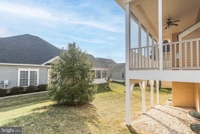 view of yard with ceiling fan