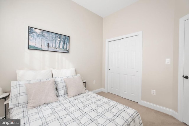 carpeted bedroom with a closet