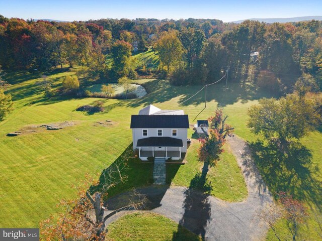 birds eye view of property with a rural view