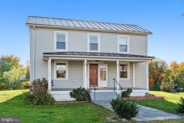 view of front of house with a front lawn and covered porch