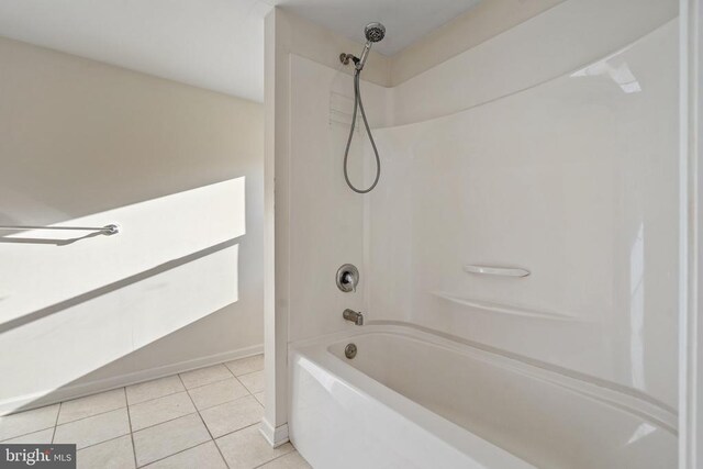 bathroom featuring shower / bathtub combination and tile patterned flooring