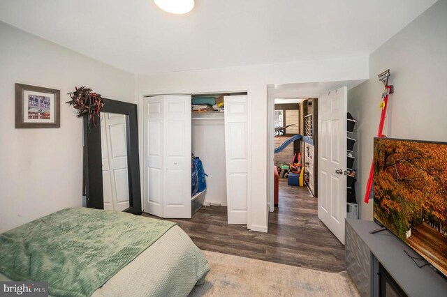 bedroom with a closet and wood finished floors