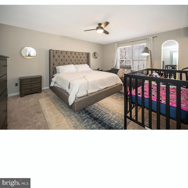 bedroom with baseboards, carpet, and a ceiling fan