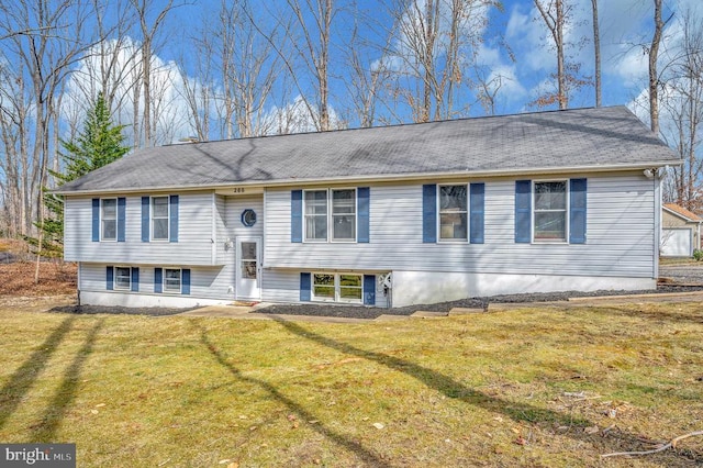 split foyer home with a front lawn