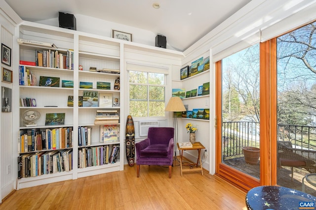 sitting room featuring lofted ceiling and wood finished floors