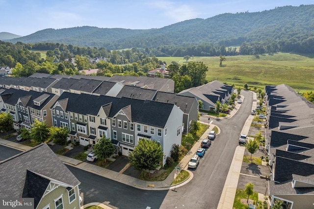 birds eye view of property with a mountain view