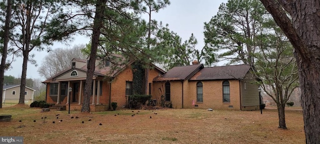 ranch-style home featuring brick siding