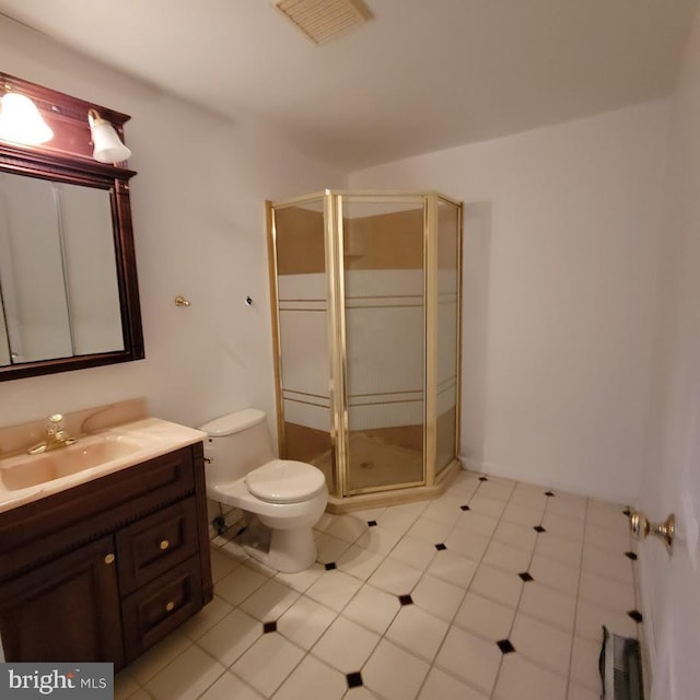 bathroom with visible vents, a shower stall, vanity, and toilet