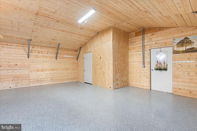 additional living space with speckled floor, lofted ceiling, wooden walls, and wood ceiling