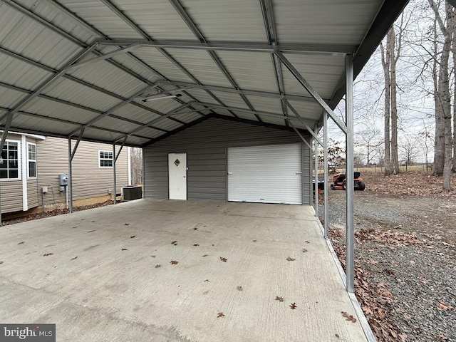 garage with a carport and central AC unit