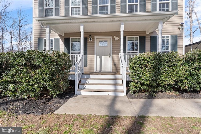 property entrance featuring covered porch