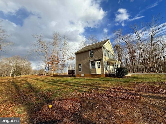 view of property exterior featuring a lawn and crawl space