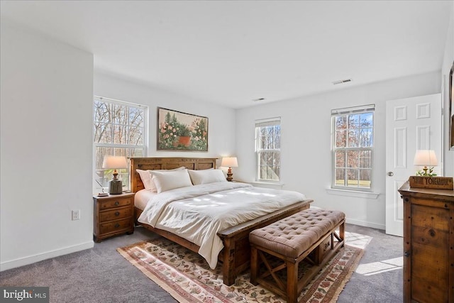 bedroom with visible vents, baseboards, and carpet