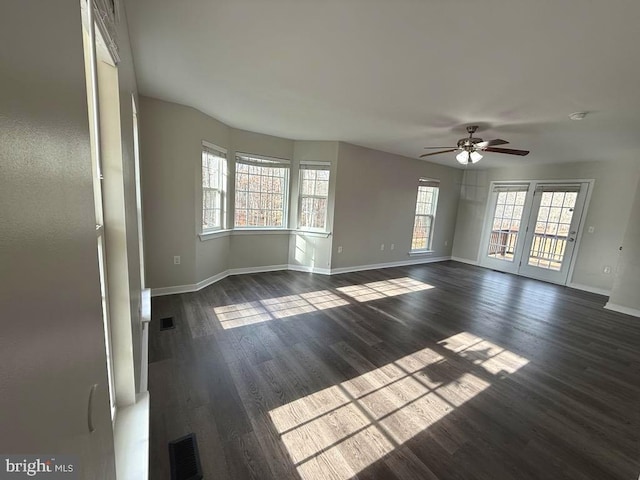 spare room featuring dark hardwood / wood-style floors and ceiling fan