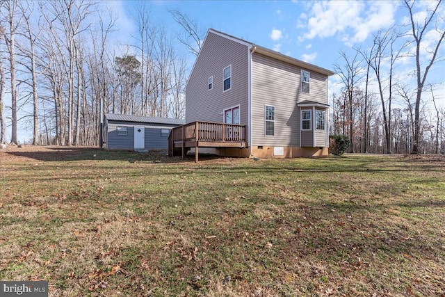 view of home's exterior featuring crawl space, a lawn, a wooden deck, and an outdoor structure