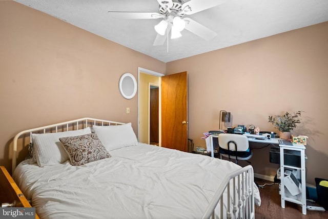 bedroom with dark wood-type flooring and ceiling fan