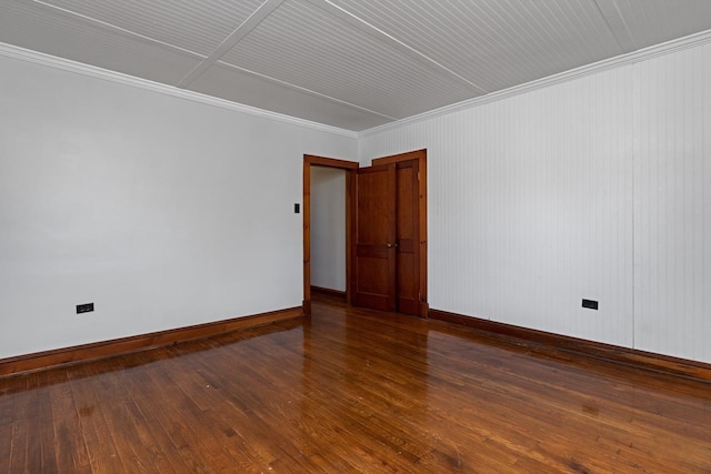 unfurnished room featuring dark hardwood / wood-style flooring and ornamental molding