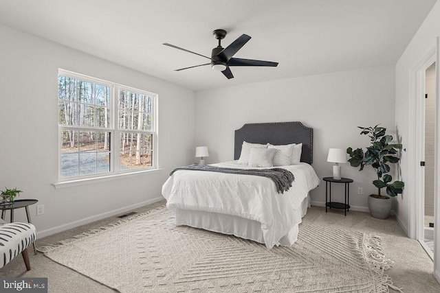 carpeted bedroom with baseboards and ceiling fan