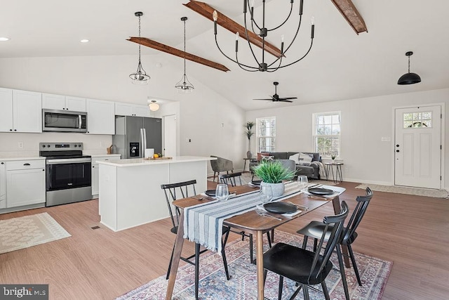 dining room with beamed ceiling, high vaulted ceiling, a ceiling fan, light wood finished floors, and baseboards