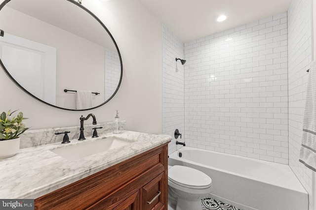 bathroom with recessed lighting, shower / bathtub combination, toilet, and vanity