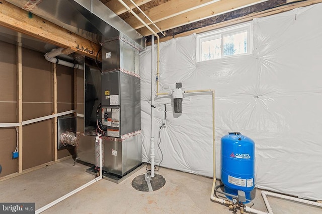 utility room featuring heating unit