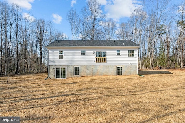 rear view of house with a lawn