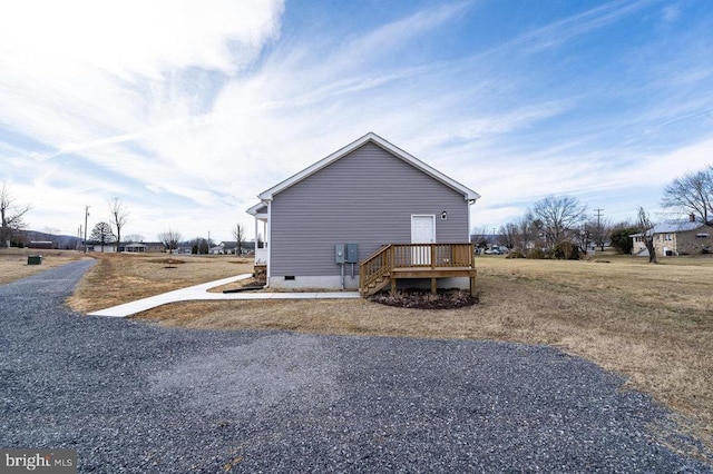 view of side of property featuring crawl space